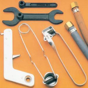Selection of flint guns, bottle spanners and gas pipes for oxygen and acetylene.